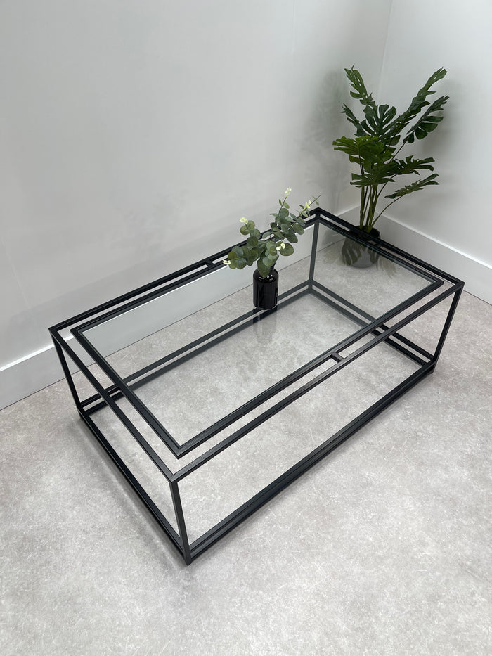 thea coffee table birds eye view showing the glass top and black metal frame