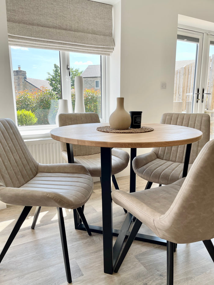 styled dining room table with wooden top and black metal legs