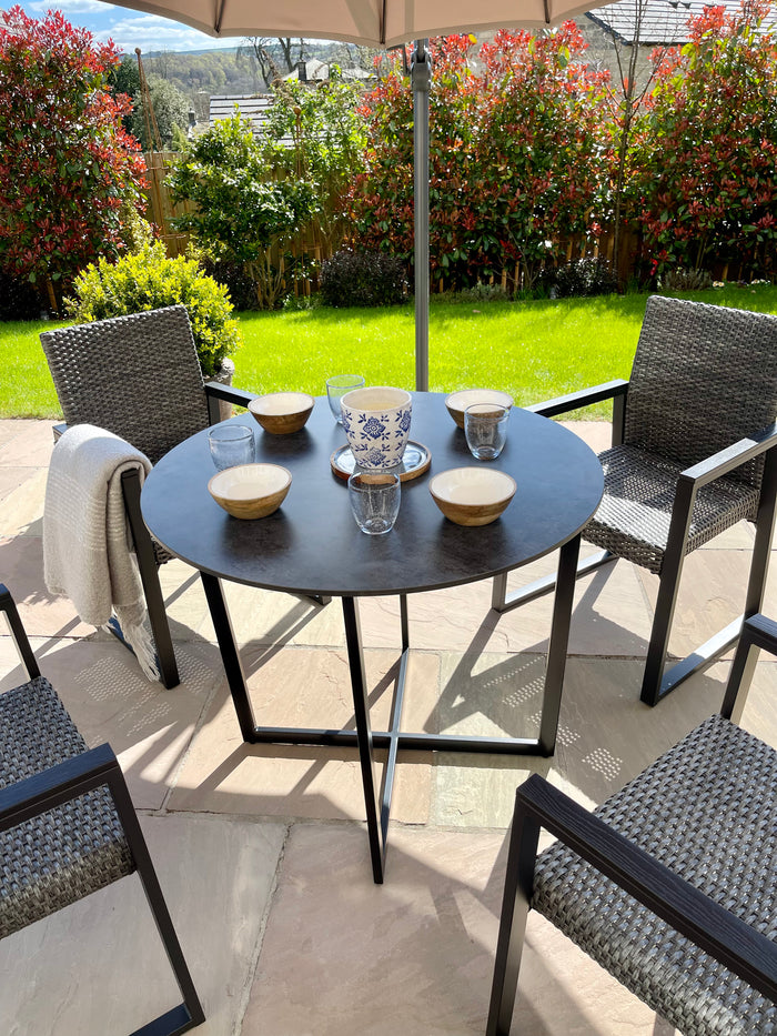 outdoor dining table set up with cross metal legs