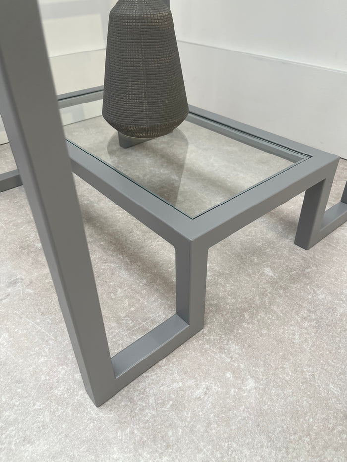 close up of light grey metal glass shelf