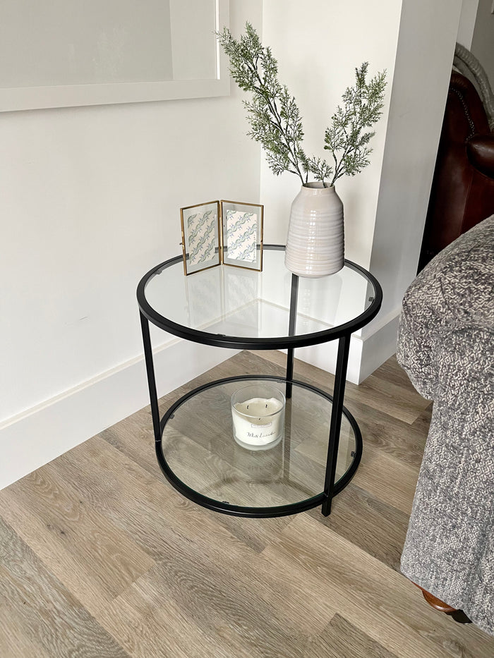 black round side metal coffee table styled in a living room