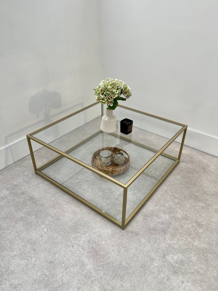 gold square metal table with glass top and shelf