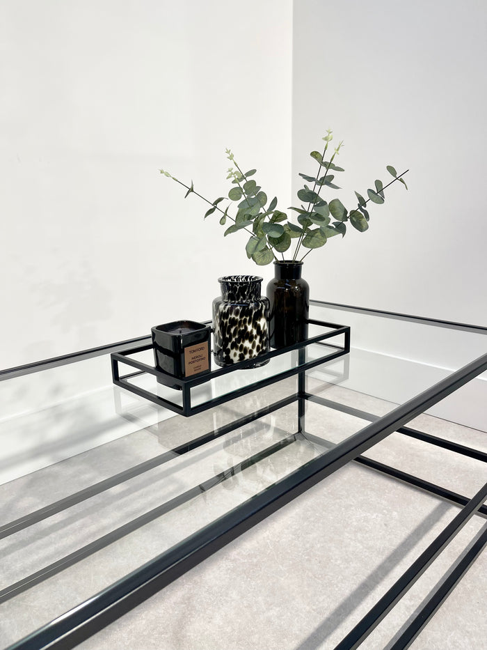 matching display tray on a glass coffee table 