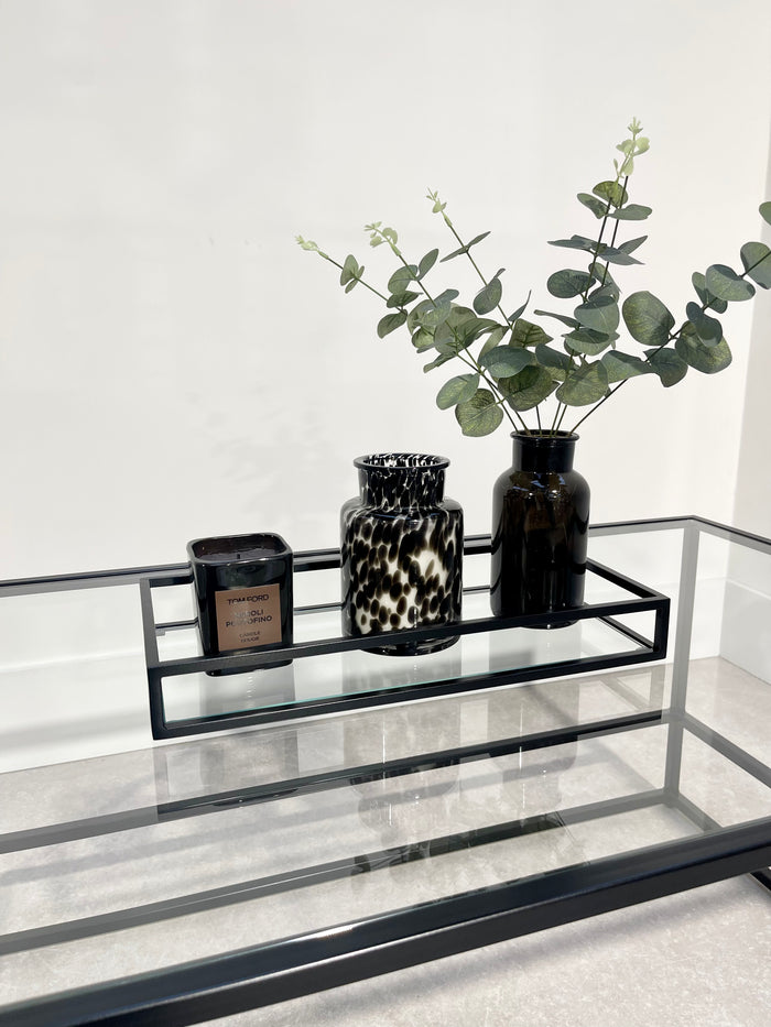 display tray styled with a candle and vases