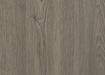 Close-up of a wooden surface with a grayish-brown color and visible grain pattern.
