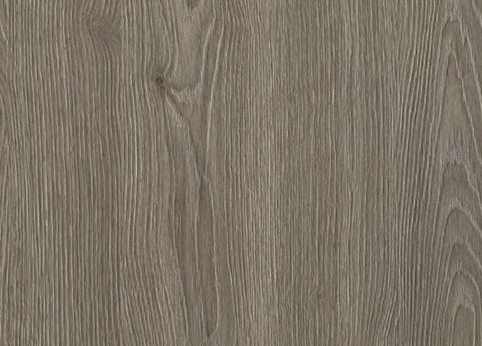 Close-up of a wooden surface with a grayish-brown color and visible grain pattern.