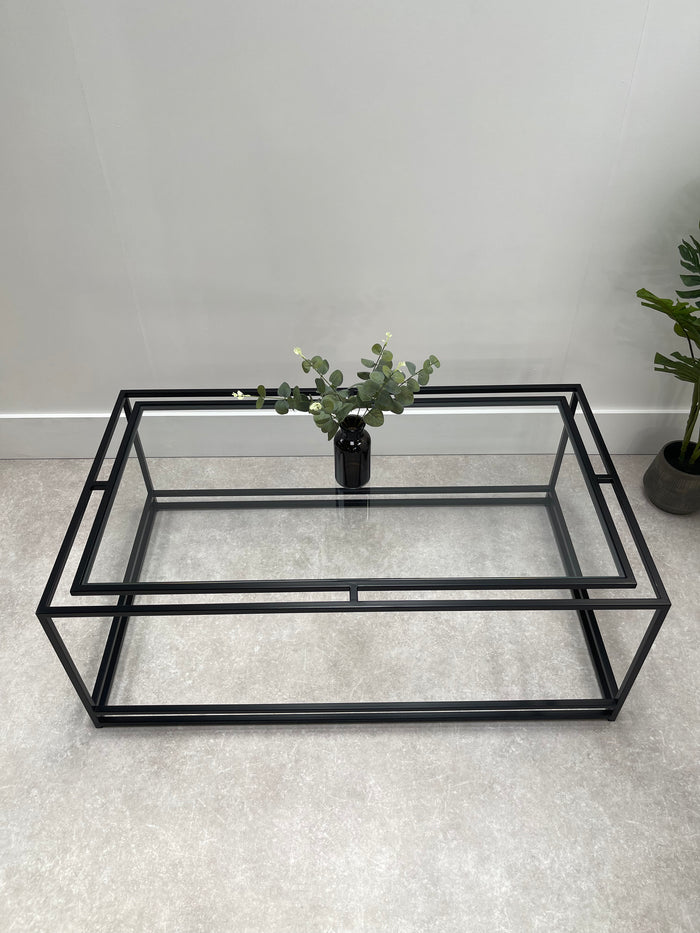 thea coffee table with black frame and glass top rectangular 