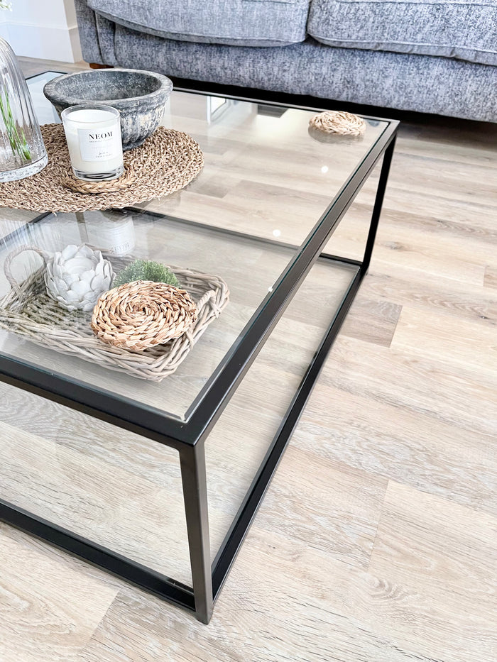 close up detail of a handmade metal and glass coffee table