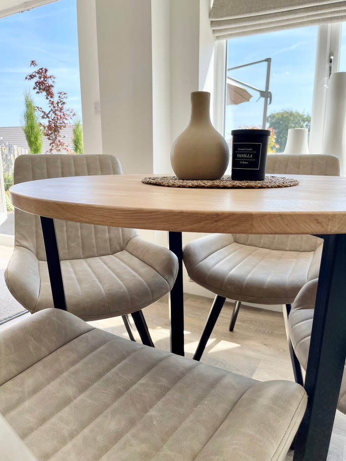 side view of a wooden top and metal leg dining room table 